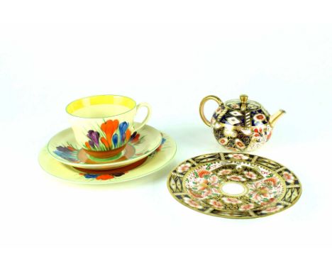 A Clarice Cliff Bizarre Crocus pattern trio comprising cup, saucer and side dish, black printed marks to base, a Davenport Im