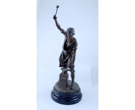 A late 19th/early 20th century Continental school bronzed spelter figure personifying Industry depicting blacksmith with tool