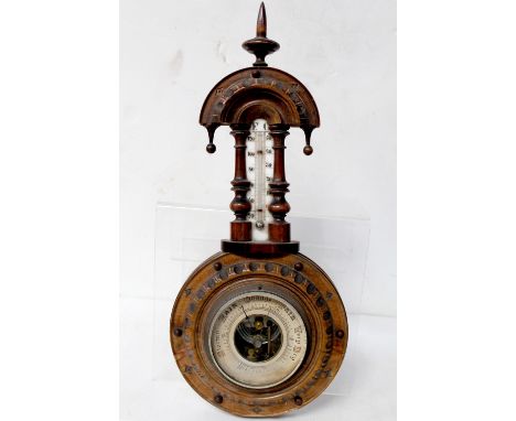 An early 20th century walnut combination wheel barometer and thermometer, length approx 40cm. CONDITION REPORT Some small chi