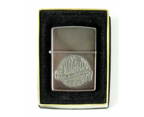 A boxed Zippo 60th Anniversary lighter 1932-1992. CONDITION REPORT Appears OK.