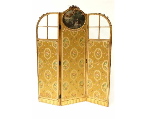A 19th century three-fold gilt wood screen, the central panel with hand coloured oval print, flanked by two bevelled glass pa