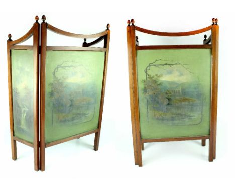 An Edwardian mahogany three-fold fire screen, each panel with hand painted woodland scene, the smaller panels with waterfalls