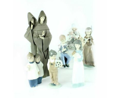 A Lladró 'Monks at Prayer' figure, height 40cm, a Lladró figure of Native American girl with white dove, four Nao figures inc