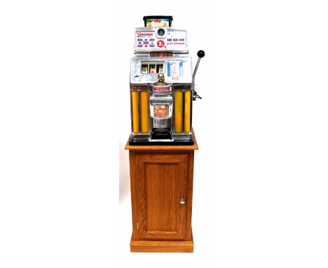 The 'Governor' by Jennings 2p slot machine with Native American finial to front, on later stand, 68 x 39cm excluding stand. C