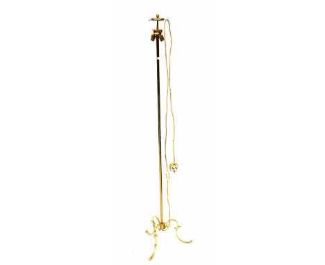 A brass standard lamp with three outswept scrolling feet (lacking shade). CONDITION REPORT Untested