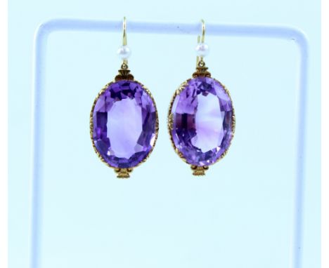 A pair of yellow metal, pearl and amethyst earrings. 