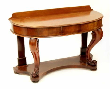 A 19th century mahogany bow-front console table with plinth back and small drawer, raised on cabriole supports on claw feet u