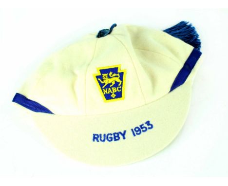 An England Boys' Club NABC Rugby cap dated 1953, in white felt with blue trims, maker's label 'Jack Hobbs Ltd' and an NABC en