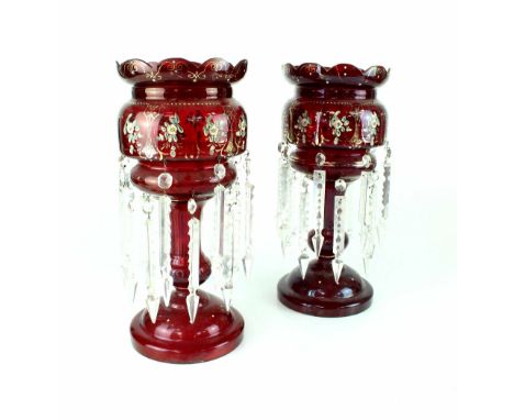 A pair of Victorian ruby glass gilt-heightened table lustres, height 38cm (2). CONDITION REPORT Several of the droplet loops 