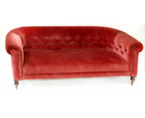 A Chesterfield-style settee upholstered in wine coloured button-back Draylon, turned and ringed legs, width 186cm.