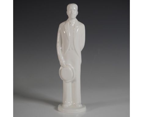 A refined white porcelain figurine from the Coalport Moments collection, titled The Groom. This elegant figure captures a gro