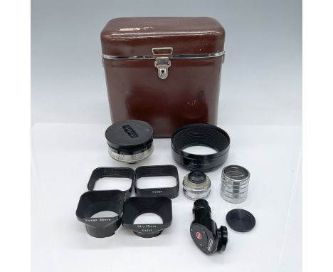 This vintage Kodak and Kalimar lens kit includes 13 pieces, all housed in a classic brown leather Kodak case measuring 6.5”H.