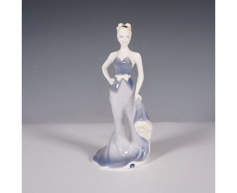 This figurine showcases timeless elegance with its graceful form and refined details. Expertly crafted and hand decorated, th