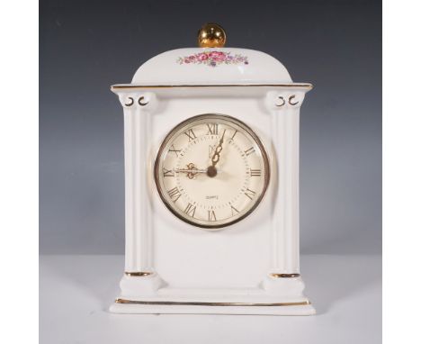 Elegant limited edition porcelain mantel clock by PS, issued in 1993. This classically inspired timepiece features a white po