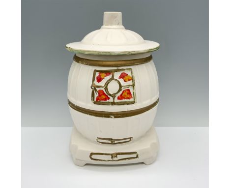Splendid white colored container themed as a pot belly stove and used to store cookies. McCoy backstamp.Issued: c. 1960sDimen