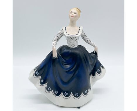 This is a stunning Royal Doulton porcelain figurine titled "Lisa," model HN2310. Designed by Peggy Davies, this elegant piece
