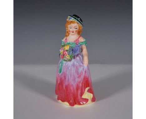 Featuring a finely crafted and hand painted design. The figurine showcases a young woman in a flowing gown with a gradient bl