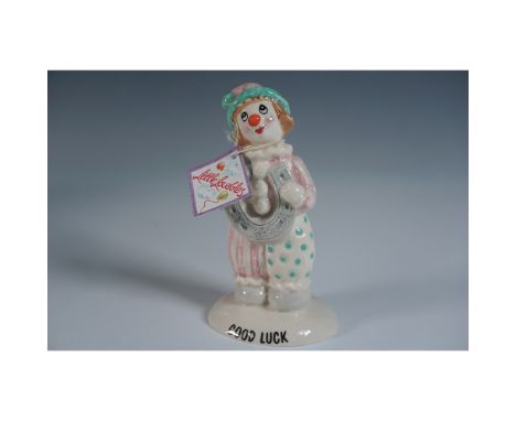 Charming Beswick porcelain figurine from the Little Baubles collection, titled Good Luck. This hand-painted ceramic sculpture