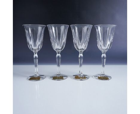This beautiful set of four full lead crystal with silver rim wine glasses is crafted by Noritake in Germany. Each glass featu