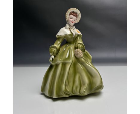 Beautiful ceramic figurine, titled Abigail. Carefully hand painted in Pasadena, California. features a flowy green dress and 