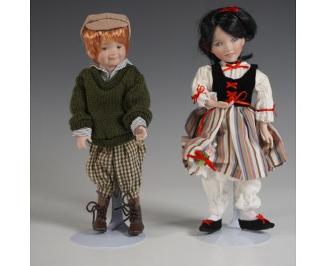 This Ashton-Drake Galleries porcelain doll set features Snow White alongside Snips and Snails, a charming duo dressed in deta