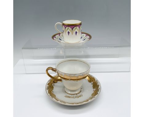 Beautiful duo of gilt cups that includes a tea cup and saucer set decorated with lilacs with a Paris backstamp, and a golden 