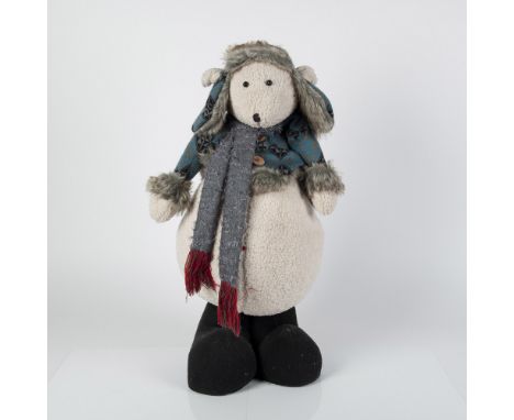 The perfect greeter, dressed in knit sweaters with matching fur lined hat and scarf around his neck.Issued: 20th centuryDimen