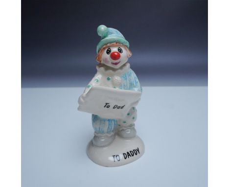 This charming John Beswick handmade ceramic figurine, titled To Daddy, features an adorable clown dressed in a blue and white