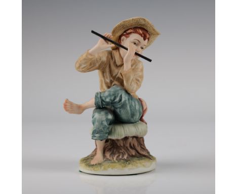 This is a delightful Lefton porcelain figurine titled Little Fiddler, depicting a young boy seated on a tree stump while play