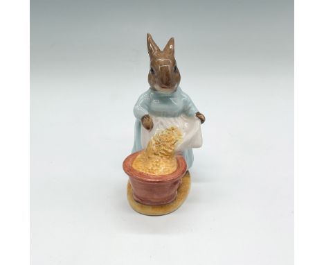 Charming Royal Albert Beatrix Potter figurine titled Cecily Parsley, depicting a brown rabbit in a blue dress pouring a sack 