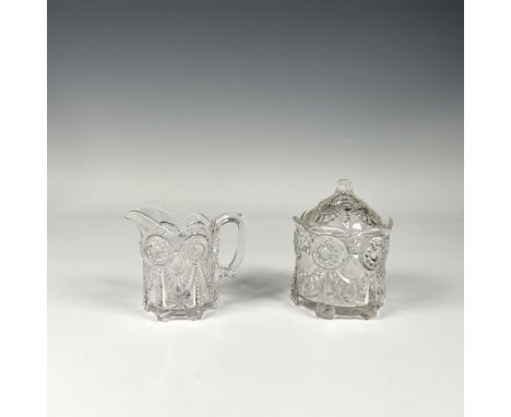 Glass sugar bowl and covered creamer, both beautifully adorned with an intricate soft, flowing floral and curtain like motifs