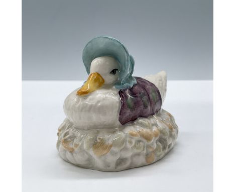 Glossy porcelain. Complete title: Jemima Puddleduck Made a Feather Nest. Modeled in a blue bonnet and purple shawl. Beswick B