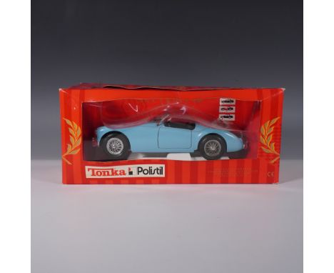 This Tonka Polistil 1:18 scale diecast model features a Lancia B24 Spider in a striking light blue finish. Produced with fine