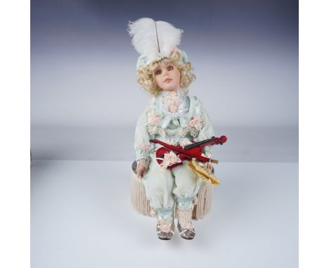 This collectible porcelain doll titled "Joseph" is part of The Queen's Court collection presented by The Welden Museum of Fin