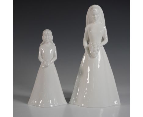 A beautiful set of Coalport Moments collection figurines, The Bride (10"H) and The Bridesmaid (7.5"H). Crafted in elegant whi
