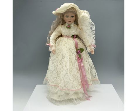 Lovely figure of a blonde woman featuring a delicate and lacy dress along with a satin hat. Metal stand included. GSO 18003 b