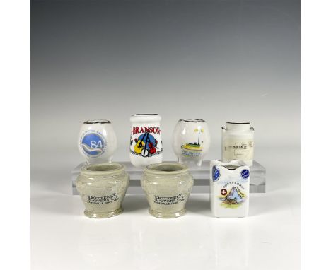 Set featuring a rectangular holder and six pot-shaped porcelain holders. The collection shows joyful travel themes from areas