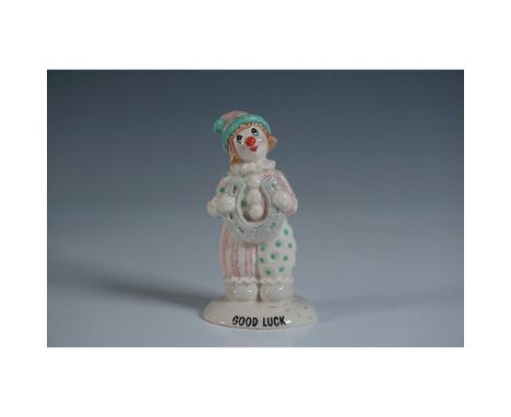 Charming Beswick ceramic figurine titled Good Luck Clown, model LL 31. This hand-painted figurine features a whimsical clown 