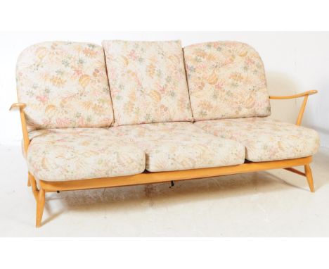 Ercol - Model 203 - A 20th century Ercol Model 203 blonde elm wood golden dawn three seater sofa settee. The sofa raised on t