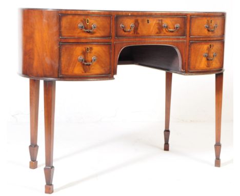 Early 20th century Edwardian circa 1900s mahogany kidney table. Having single drawer above knee hole, flanked by two graduati