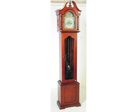 Tempus Fugit - A 20th century Tempus Fugit longcase grandfather clock. The clock having mahogany veneer case with glass front