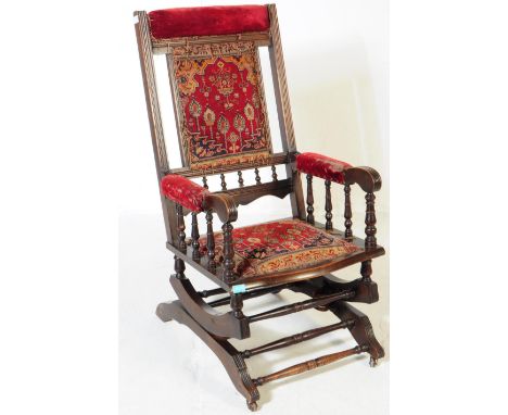 A 19th century Victorian mahogany Boston rocker American manner rocking armchair. The chair having tapestry manner needlework