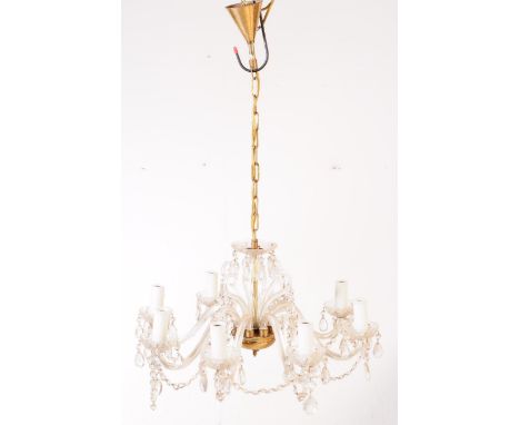 A vintage 20th century venetian style eight arm glass lozenge droplet chandelier. With lozenge string decoration, clear glass