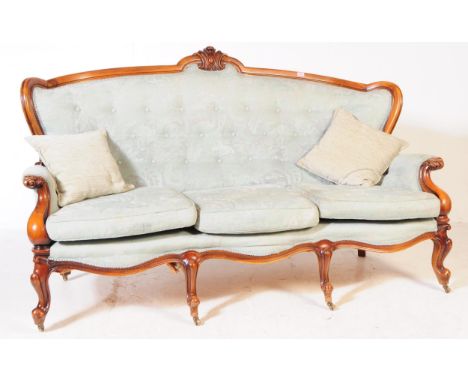 A Italian rococo revival three seater sofa / settee. Having a mahogany frame with green upholstered fabric button back seat. 