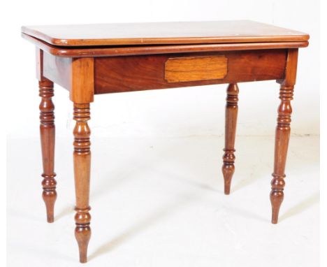 A 19th century mahogany card table. The table having swivel action folding top with compartment within and being raised over 