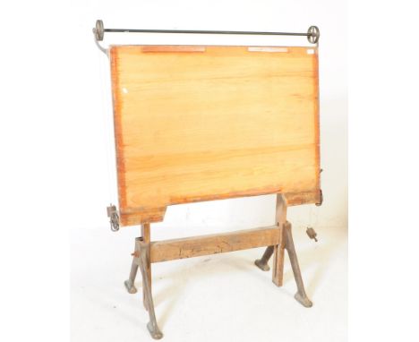 An early 20th century Draughtsman's architectural drafter writing table. Having a large rectangular wooden writing platform w