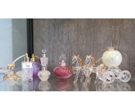 A Caithness glass scent bottle, a Murano glass scent bottle, four others and a glass carriage pulled by two horses