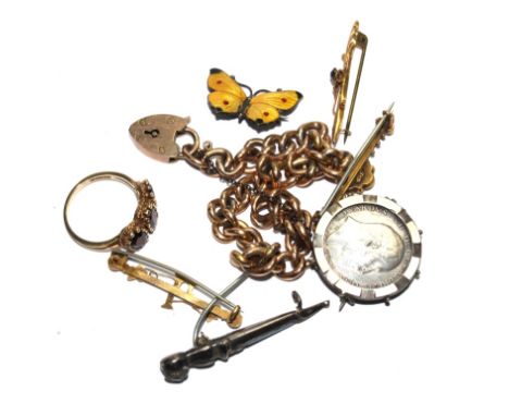 A 9 carat rose curb link bracelet, a garnet ring, a small enamel butterfly, a Scottish dagger brooch, etc