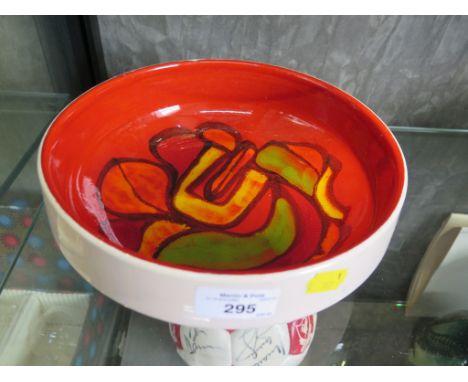 A Poole Pottery fruit bowl in red, green and yellow decoration, 23cm diameter