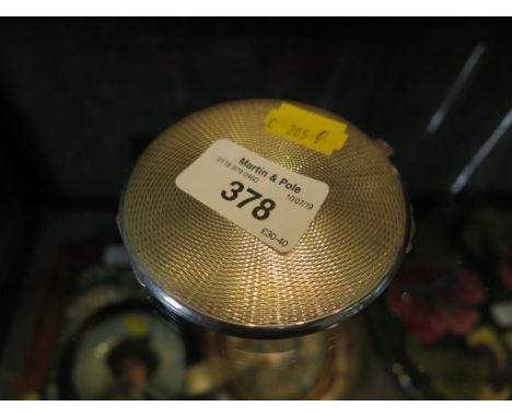 A silver ladies compact